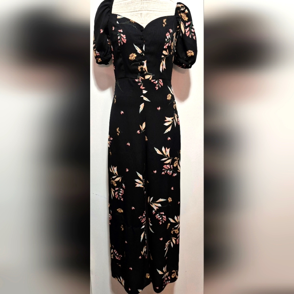 GIANNI BINI BLACK JUMPSUIT WITH FLORAL PATTERN. NWOT